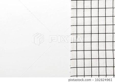 top view with white empty kitchen napkin isolated on table background. Folded cloth for mockup with copy space, Flat lay. Minimal style 102824961