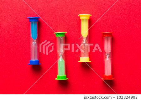 hourglass on the table, sand clock as time passing concept for business deadline, copy space hourglass on the table, sand clock as time passing concept for business deadline, copy space 102824992