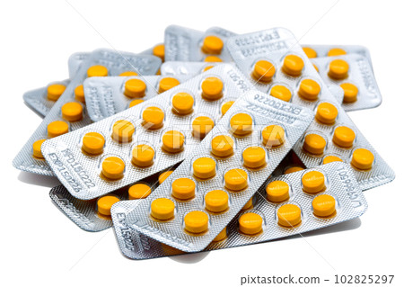 Pile of medicine strips with manufactiring date and expiry date. 102825297