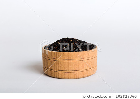quinoa seeds in bowl on colored background. Healthy kinwa in small bowl. Healthy superfood quinoa seeds in bowl on colored background. Healthy kinwa in small bowl. Healthy superfood 102825366