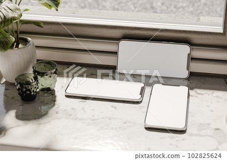 Modern cellphones placed on marble windowsill. 3d render Modern cellphones placed on marble windowsill. 3d render 102825624