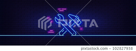 Neon light glow effect. Spanner and hammer line icon. Repair service sign. Fix instruments symbol. 3d line neon glow icon. Brick wall banner. Spanner tool outline. Vector 102827938