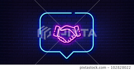 Neon light speech bubble. Handshake line icon. Hand gesture sign. Business deal palm symbol. Neon light background. Handshake glow line. Brick wall banner. Vector 102828022
