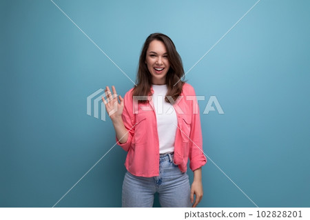 cheerful positive brunette young female adult in a shirt with joyful emotions on an isolated 102828201