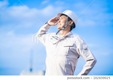 A middle-aged male administrator in a helmet 102830025