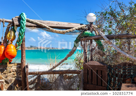 Nautical style hanging decoration and sea view Nautical style hanging decoration and sea view 102831774