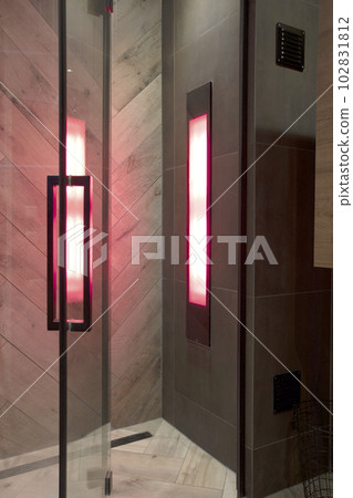 Sunshower in a bathroom,with uv lights, lights glowing while water is flowing. worked Solarium with ultraviolet light. Infra red lights body relexation Sunshower in a bathroom,with uv lights, lights glowing while water is flowing. worked Solarium with ultraviolet light. Infra red lights body relexation 102831812