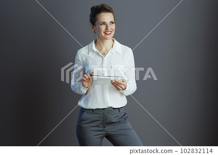 business owner woman using applicationst PC isolated on gray 102832114