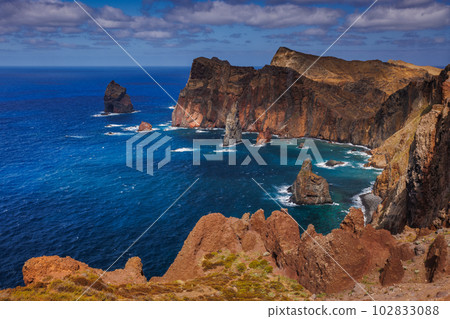 Volcanic sea cliffs of the Sao Lourenco peninsula, eastern Madeira, Portugal, Atlantic Ocean 102833088