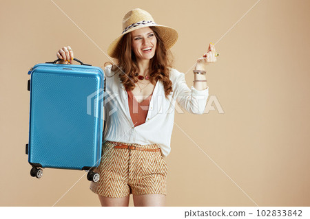 smiling elegant woman finger snapping isolated on beige smiling elegant woman finger snapping isolated on beige 102833842