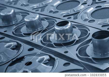 The close up scene of product parts from progressive die. 102833855