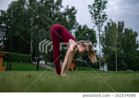 Girl practice yoga and meditation in the city. Girl practice yoga and meditation in the city. 102834086