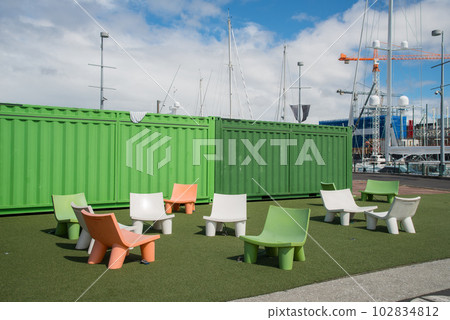 Deck chair for recreation in Wynyard Quarter of Auckland city, New Zealand. Deck chair for recreation in Wynyard Quarter of Auckland city, New Zealand. 102834812
