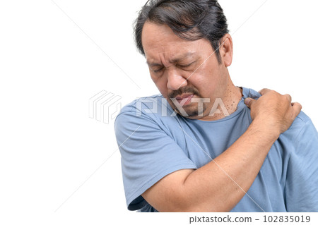 Middle aged man feel neck pain due to working in front of a computer for a long time 102835019
