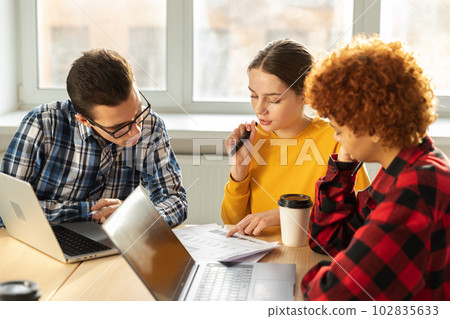 Focused female team leader discuss financial statistics brainstorming business meeting with partners clients at office. Lady boss leader young businesswoman. Diverse corporate professional team Focused female team leader discuss financial statistics brainstorming business meeting with partners clients at office. Lady boss leader young businesswoman. Diverse corporate professional team 102835633
