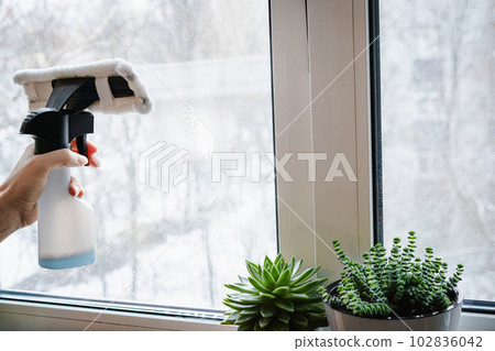 Hand washing and cleaning window Hand washing and cleaning window 102836042