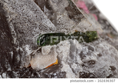 Macro mineral tourmaline stone in quartz on a white background 102836307
