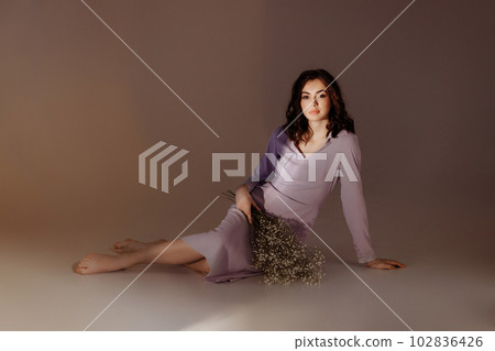 Attractive woman with bouquet on abstract background Attractive woman with bouquet on abstract background 102836426