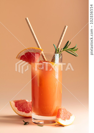 Summer cocktail with grapefruit, rosemary, and ice. Summer cocktail with grapefruit, rosemary, and ice. 102836554