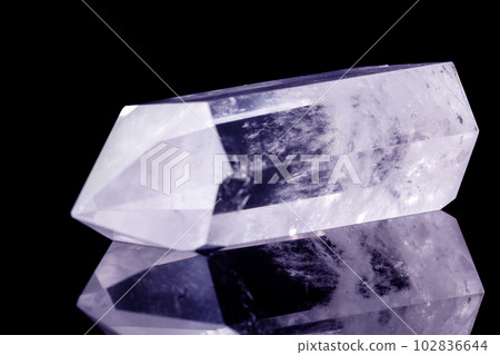 Macro mineral stone Crystal rock crystal on a black background 102836644
