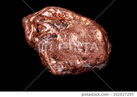 Macro mineral stone of a copper nugget on a microcline on a black background 102837205