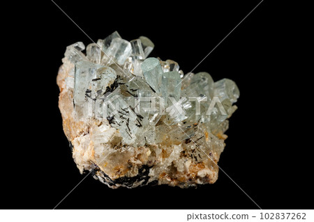 Macro mineral stone crystals Aquamarine in rock on a black background Macro mineral stone crystals Aquamarine in rock on a black background 102837262