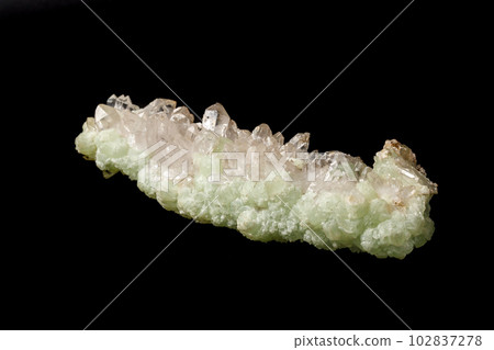 Macro mineral stone Prehnite quartz on a black background 102837278