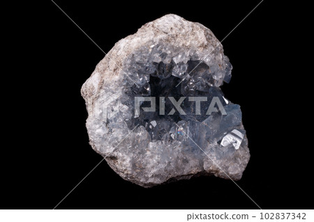 Celestine mineral stone macro on microcline on black background 102837342