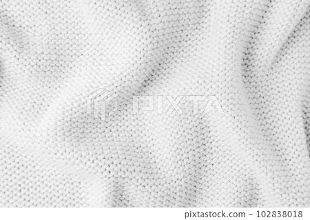 White knitwear wool fabric texture background. Abstract textile backdrop White knitwear wool fabric texture background. Abstract textile backdrop 102838018