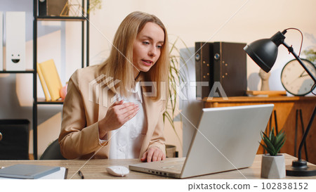 Businesswoman working on laptop at office talk on online communication video call with employee boss 102838152