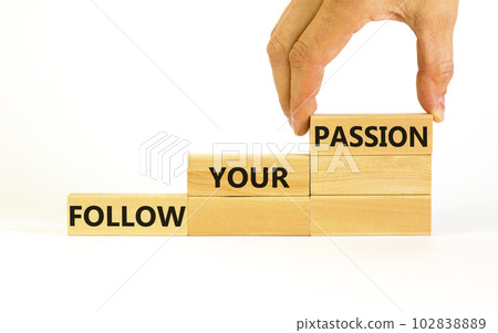 Follow your passion symbol. Concept words Follow your passion on blocks on beautiful white table white background. Businessman hand. Business, motivation and follow your passion concept. Copy space. Follow your passion symbol. Concept words Follow your passion on blocks on beautiful white table white background. Businessman hand. Business, motivation and follow your passion concept. Copy space. 102838889