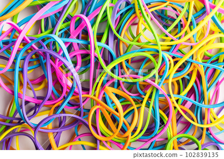 Many colorful rubber bands. Closeup. 102839135