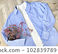 Spring/summer shopping image Blue shirt and bouquet 102839789