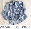 Light blue satin blouse with frills 102839807