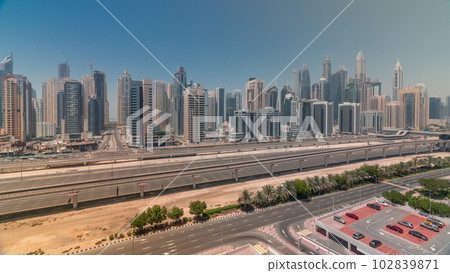 Dubai marina tallest block of skyscrapers all day timelapse. 102839871
