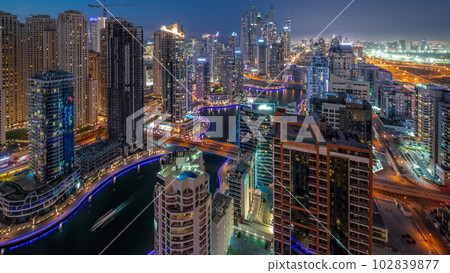 View of various skyscrapers in tallest recidential block in Dubai Marina aerial day to night timelapse View of various skyscrapers in tallest recidential block in Dubai Marina aerial day to night timelapse 102839877