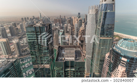 Panorama showing Dubai Marina and JLT with JBR district. Ttraffic on highway between skyscrapers aerial timelapse. Panorama showing Dubai Marina and JLT with JBR district. Ttraffic on highway between skyscrapers aerial timelapse. 102840007