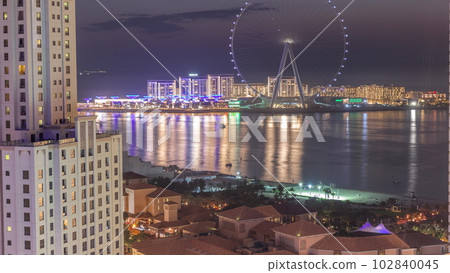 Bluewaters island with modern architecture and ferris wheel aerial day to night timelapse. Bluewaters island with modern architecture and ferris wheel aerial day to night timelapse. 102840045