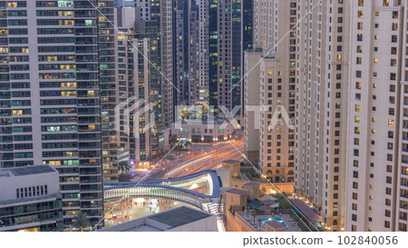 Overview to JBR and Dubai Marina skyline with modern high rise skyscrapers waterfront living apartments aerial day to night timelapse Overview to JBR and Dubai Marina skyline with modern high rise skyscrapers waterfront living apartments aerial day to night timelapse 102840056