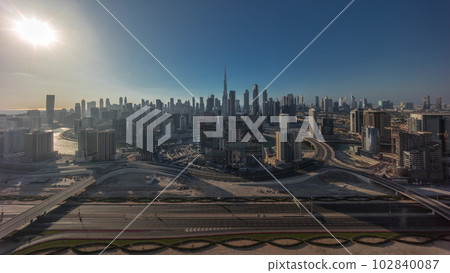 Panoramic skyline of Dubai with business bay and downtown district all day timelapse. 102840087
