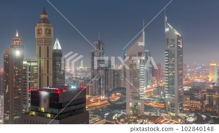 Skyscrapers on Sheikh Zayed Road and DIFC day to night timelapse in Dubai, UAE. 102840148