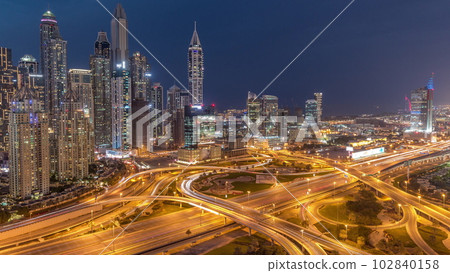 Dubai Marina highway intersection spaghetti junction day to night timelapse Dubai Marina highway intersection spaghetti junction day to night timelapse 102840158