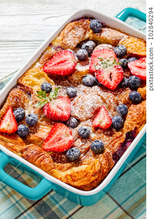 Sweet Croissant Casserole with Berries in dish 102840294