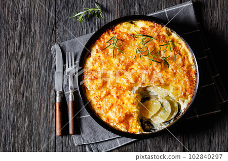 cheesy potato bake or potato casserole, top view 102840297
