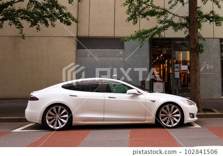 Tesla parking on the street 102841506