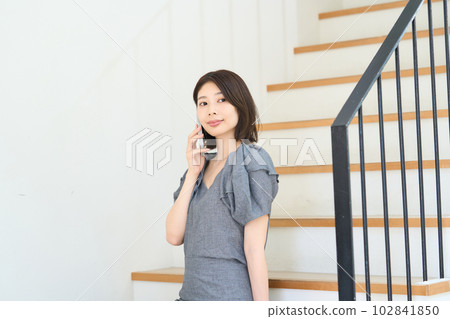 A young lady with a smartphone A young lady with a smartphone 102841850