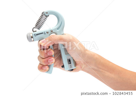 Hand of Adult Man Using Hand Gripping Exercise to Exercise His Fingers, Palm and Forearm on iSolated White Background Hand of Adult Man Using Hand Gripping Exercise to Exercise His Fingers, Palm and Forearm on iSolated White Background 102843455