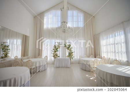 Wedding hall or other function facility set for fine dining. Wedding hall or other function facility set for fine dining. 102845064