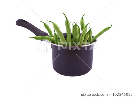 Handful of green beans in the pot isolated on white 102845095
