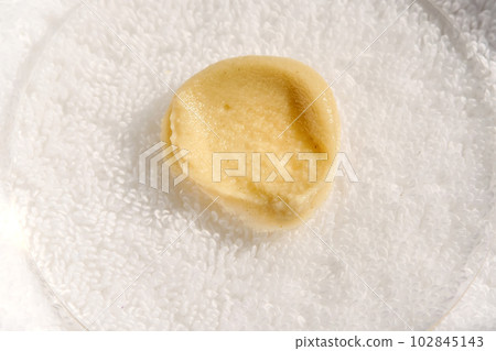 Swatch peeling on the background of the towel. 102845143